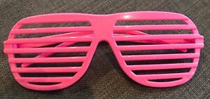 A pair of pink plastic "venetian blinders",aka "shutter shades".